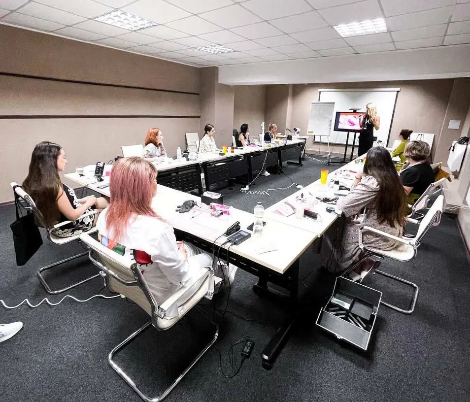 Student practising permanent makeup technique during a masterclass
